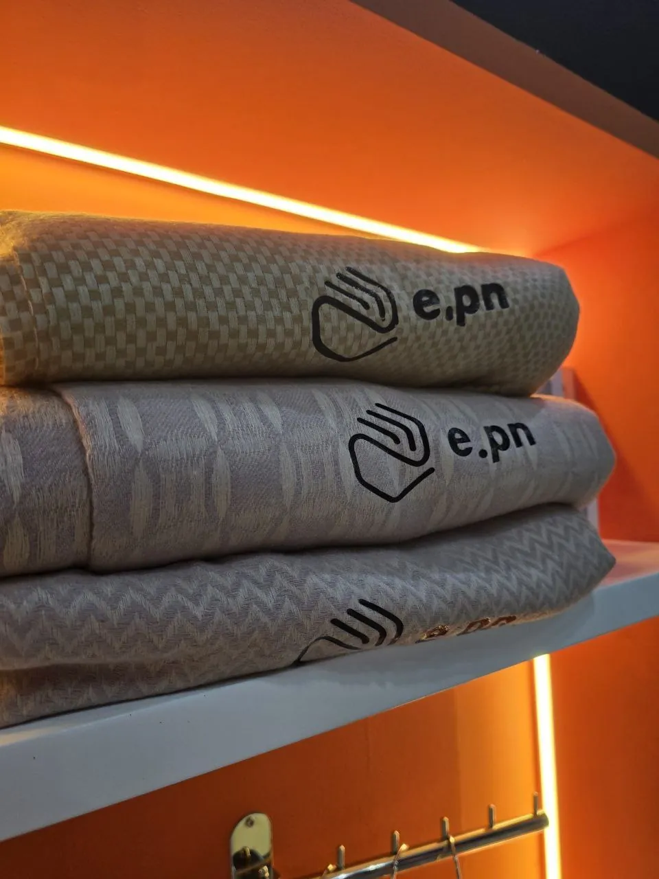Custom e.pn branded textile displayed at an event