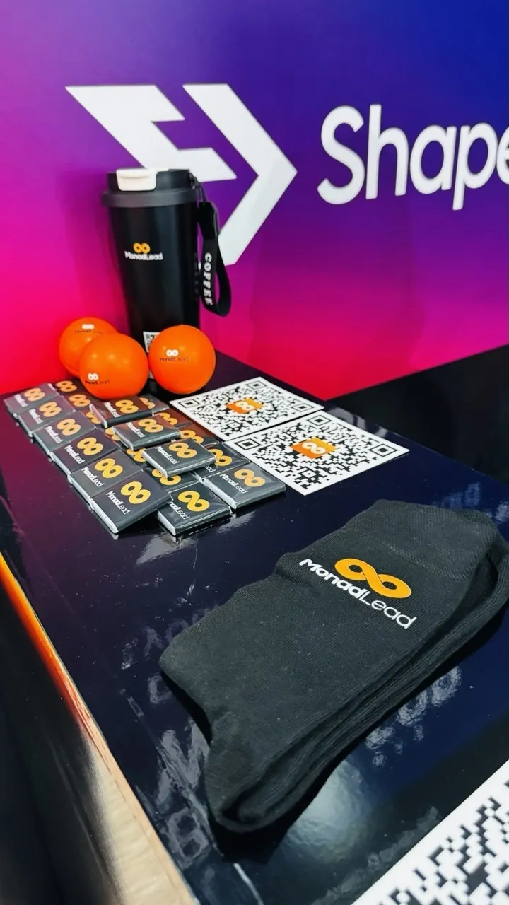 Monolead branded socks, bottles and giveaways at a conference booth
